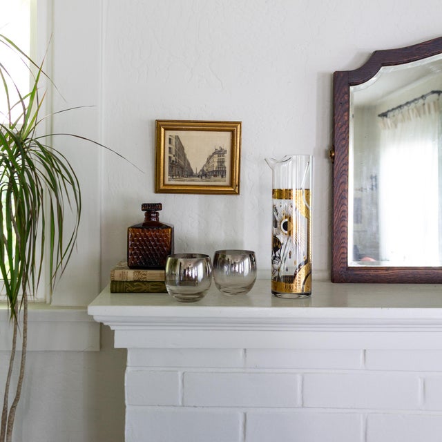 Vintage Fred Press Glass Cocktail Pitcher features the iconic gold and black Trojan Horse design, with the designer's...