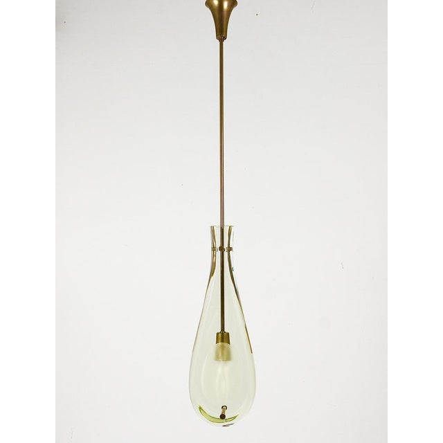 A stunning mid-century ceiling pendant light chandelier dating back to the 1960s. Model no. 2259, handcrafted by fontana...