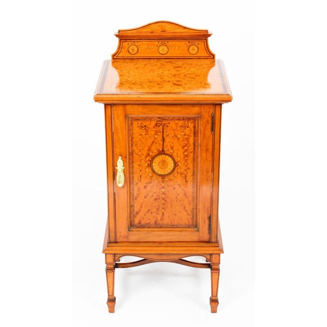 This is a splendid antique Victorian satinwood bedside cabinet, circa 1880 in date. This superb piece features attractive...