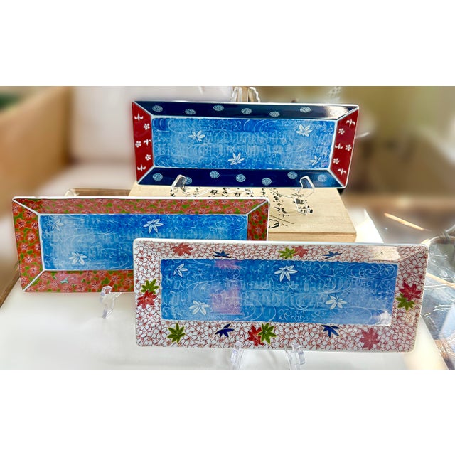 Three (3) Vintage Japanese sushi plates. New in wood box. Never used. A set of beautiful, vibrant sushi plates / platters....