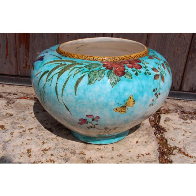 Edmond Lachenal (1855-1930). Earthenware cachepot with polychrome decoration of a bird, butterflies, and flowers. Signed...
