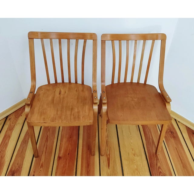 A pair of chairs designed by L.Volak for Drevopodnik Holesov, TON. Superb form of Volak's chairs from the 1960s. Pair in...