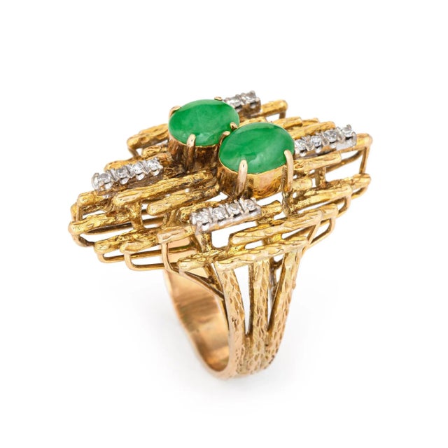 Stylish vintage abstract jade & diamond ring (circa 1970s) crafted in 14 karat yellow gold. Jade cabochons are estimated...