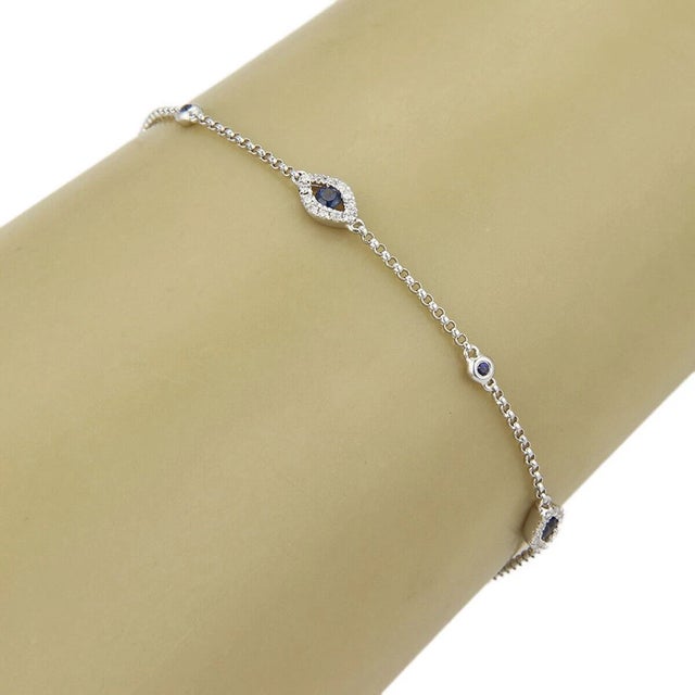 The Evil Eye 18k White Gold Blue Sapphire & Diamonds Bracelet is a stunning piece of fine jewelry that exudes elegance and...
