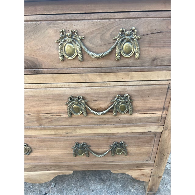 An elegant 18th-century French Louis XVI chest of drawers, handcrafted from solid walnut and finished in a soft bleached...