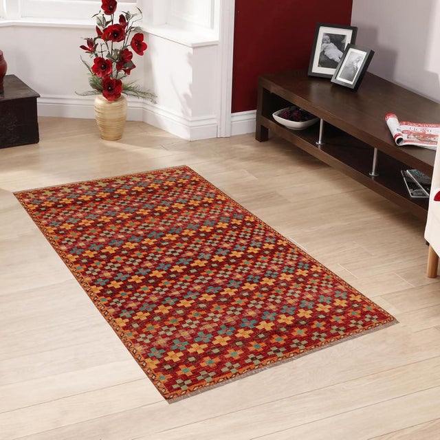 This stunning hand-knotted Afghan Balouchi rug is a captivating addition to any decor. Crafted by skilled artisans, it...