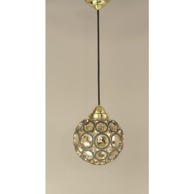 Minimalist pendant light made of metal and glass. Diameter: 21 cm Total length with cable and canopy: 150 cm. Up to 250V...