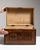 This 1900 - 1909 box from Belgium is finished in chocolate, worked in wood. Its form follows honest, well-proportioned...