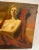 A very beautiful oil on canvas painting of a Nude woman seated on a red fabric. Very fine details. A great art collectible.