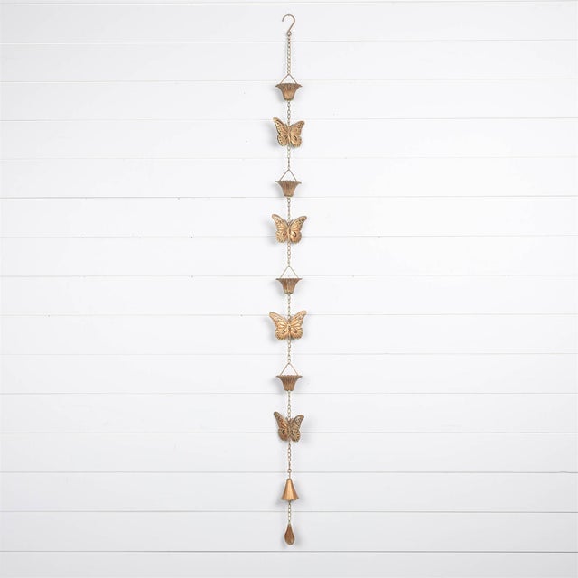Enhance your garden's charm with the Copper Butterfly Rain Chain. Designed to guide rainwater down its cascading cups,...