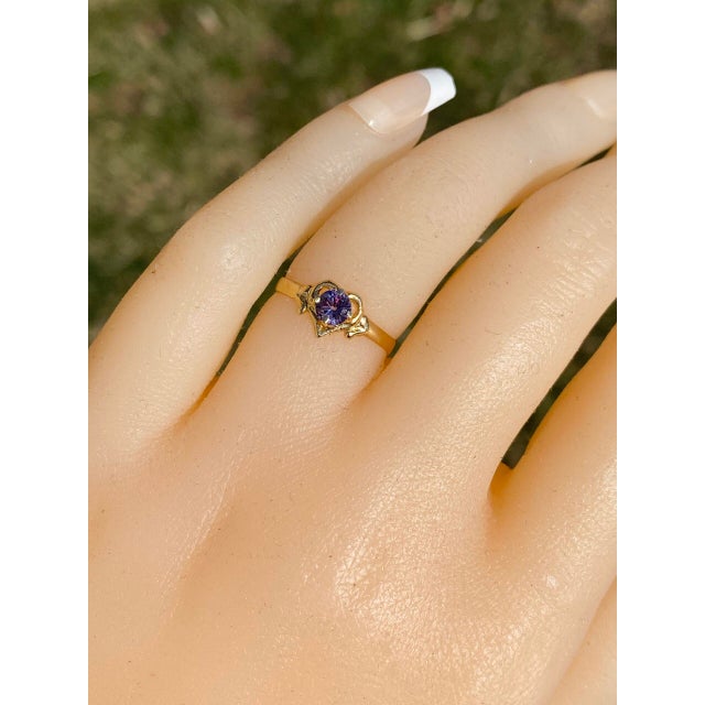 The Winnipeg: Lab Created Color Change Ring in Yellow Gold. This enchanting ring features a captivating lab-created color-...