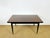 A french art deco dining table dating from the 1960s, featuring two extension leaves. this elegant extendable table,...