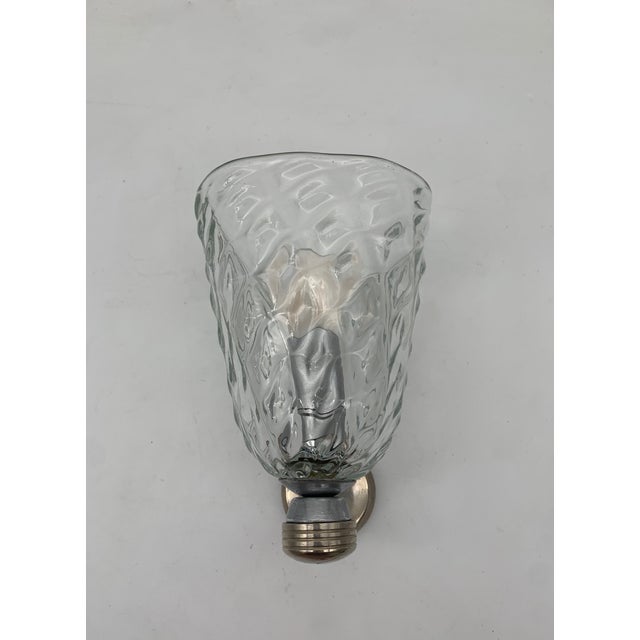 Wall lamp attributed to Barovier with a clear glass diffuser shaped like a cone, featuring a relief pattern on the glass...