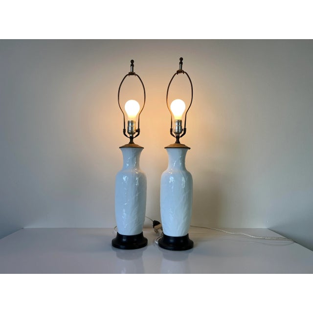 Stunning pair of Vintage Palm Beach Hollywood Regency style white porcelain jar form decorative table lamps, circa...