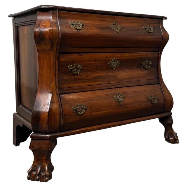 A beautifully crafted 20th-century small Dutch Bombe chest of drawers, distinguished by its elegant serpentine form,...