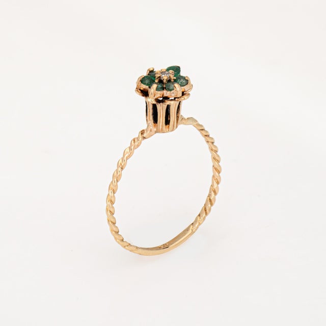 Stylish vintage emerald & diamond tulip ring (circa 1960s to 1970s) crafted in 14 karat yellow gold. Round brilliant cut...
