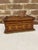 A finely crafted example of American folk art, this early-20th-century tramp art box showcases exceptional chip-carving...
