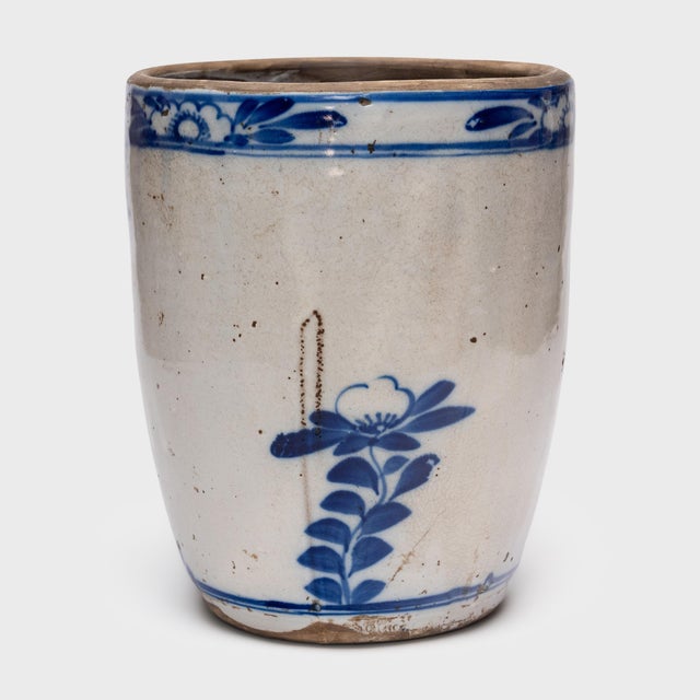 Beautifully glazed in the blue-and-white manner, this antique Chinese vessel from the early 20th century was originally...
