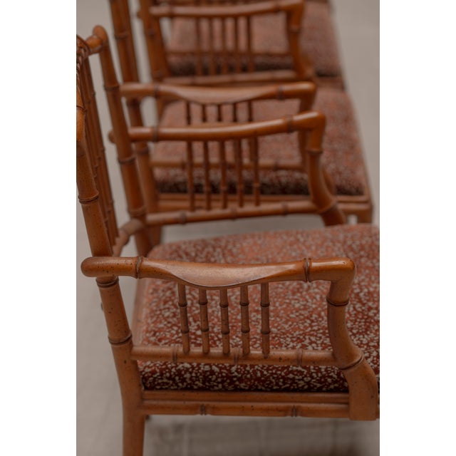 Elegant set of four Italian faux bamboo armchairs from the 1970s, beautifully combining playful craftsmanship with refined...