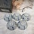 A set of Japanese blue-and-white small bowls, shaped like chrysanthemum petals and featuring delicate, elegant blue-and-...