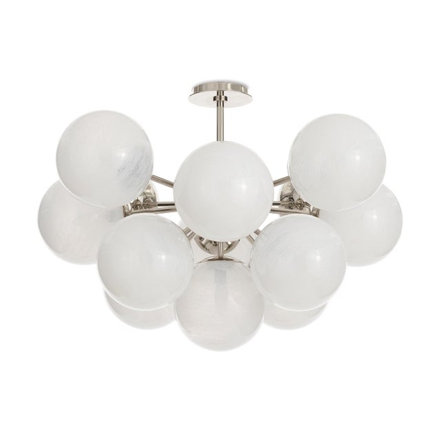 The Shine Flush Mount epitomizes contemporary sophistication with a touch of mid-century modern influence. The fixture's...