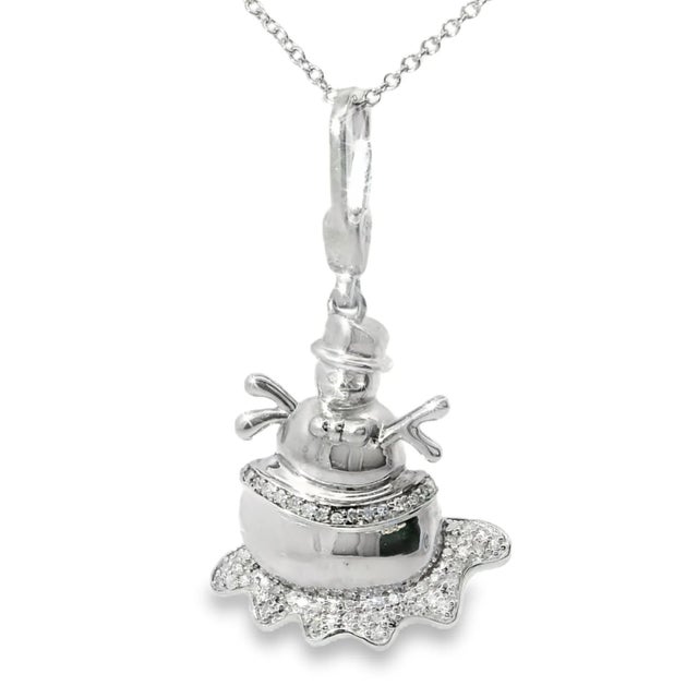 This charming sterling silver snowman pendant sparkles with brilliant white diamonds , making it a whimsical and elegant...