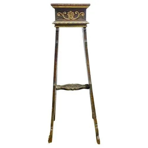 Antique acanthus leaf handcarved, painted and gilt Etruscan style pedestal with a handcarved stretcher. Stylized foliate...