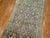 A long and narrow Persian Malayer runner from the early 20th century. Measures: 2'9" x 19'8".