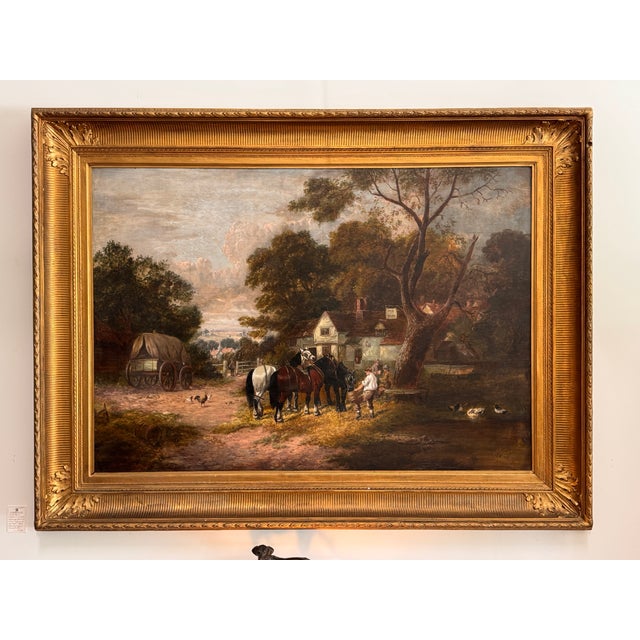A large-scale late 19th C. English oil on board painting depicting a rural tavern scene with a man watering a team of...