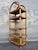 Vintage Coastal Style Arched Rattan Etagere/ Bookcase in the McGuire's Manner. Circa 1970s. Features a clean Bohemian...