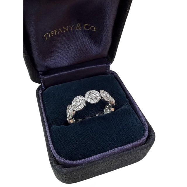 This beautifully classic ring by Tiffany & Co. contains 130 round brilliant cut diamonds weighing approximately 2.00...