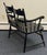 Charming vintage Hitchcock-style painted settee featuring a classic black finish accented with hand-painted gold...