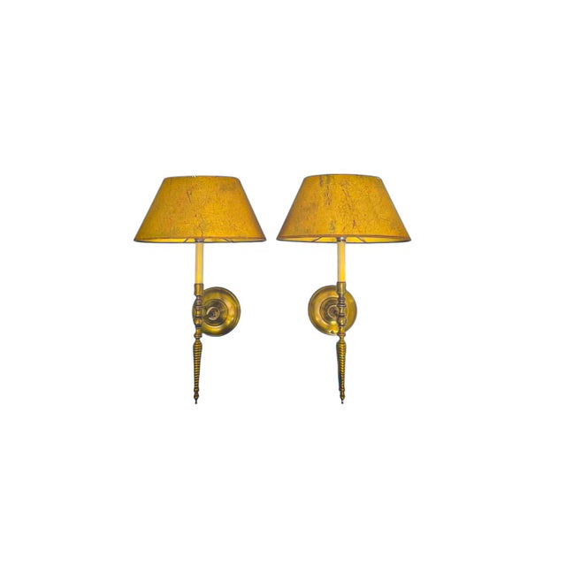 An elegant pair of French brass wall sconces from the 1970s, with beautiful ‘Barley Twist’ stems and intricate brass...