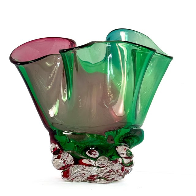 A beautifully sculptural signed art glass vase by contemporary American glass artist David Van Noppen. Featuring an...