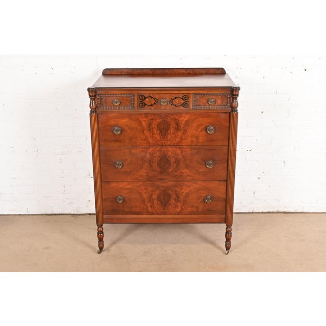 A gorgeous antique French Regency Louis XVI style highboy dresser or chest of drawers In the manner of Berkey & Gay USA,...