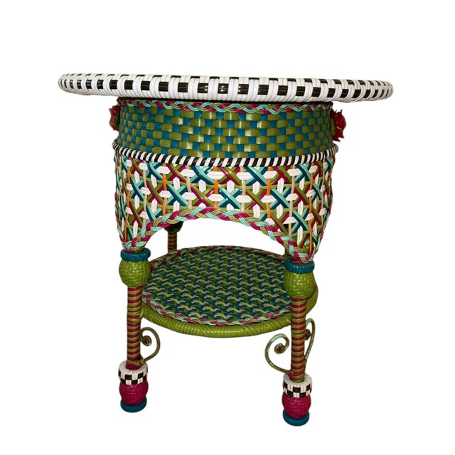 Typical whimsical wicker Mackenzie Childs table