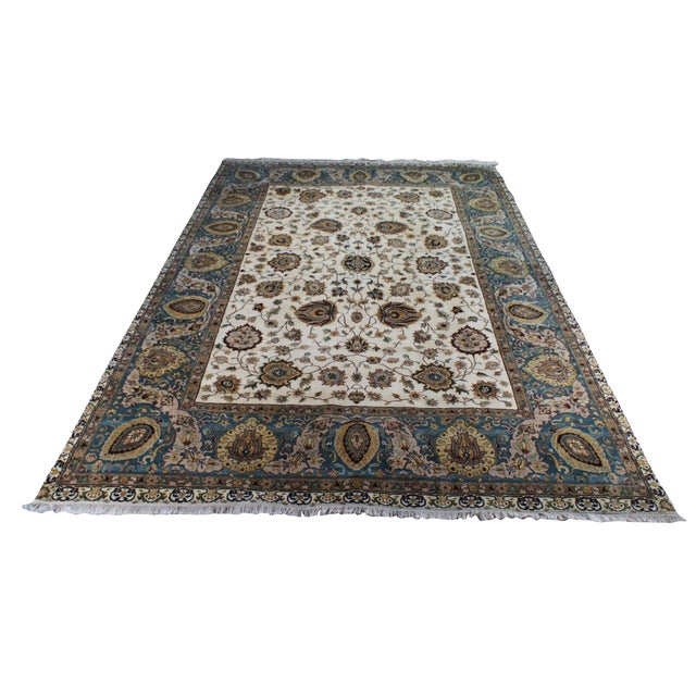 This traditional hand-knotted oriental rug features an elegant, high-contrast design characterized by an all-over floral...