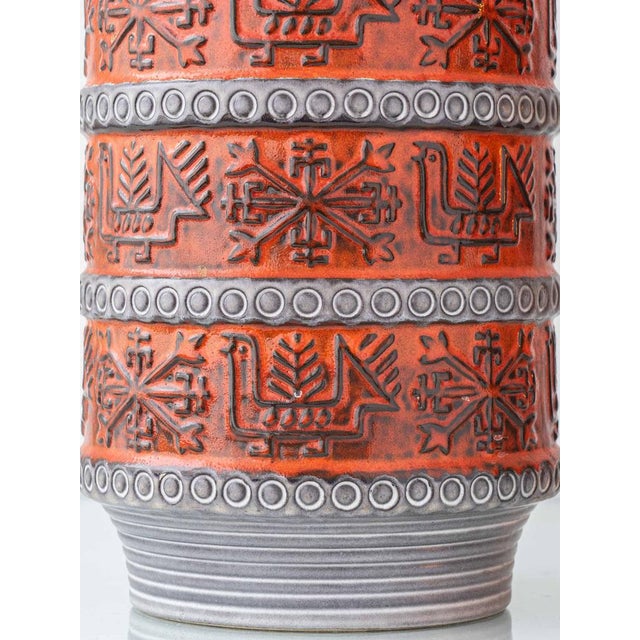 Striking West German ceramic table lamp by Bay Keramik, distinguished by bold orange relief decoration over matte grey...