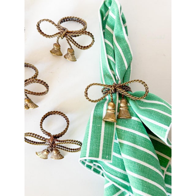 So charming! Set of six brass tassel bow napkin rings, "tied" out of a twisted brass rope. They are sturdy and fixed, not...
