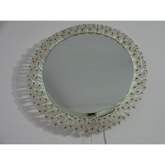 Illuminated wall mirror with glass flowers from the 1960s.