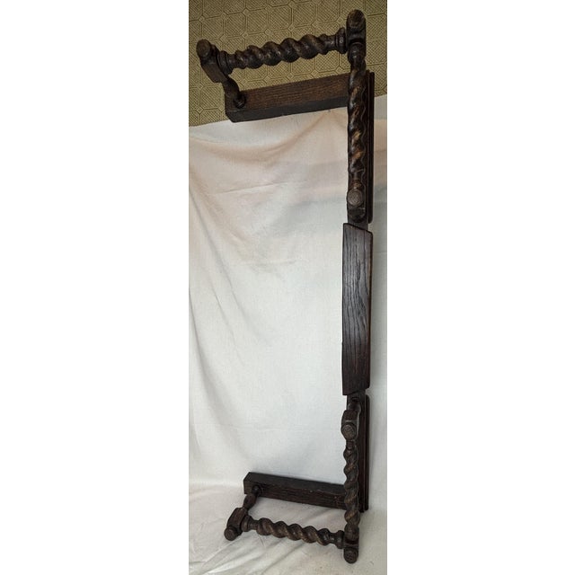 This fireplace fender has great patina and looks really old. But, the twisted carvings look to us to be synthetic,...