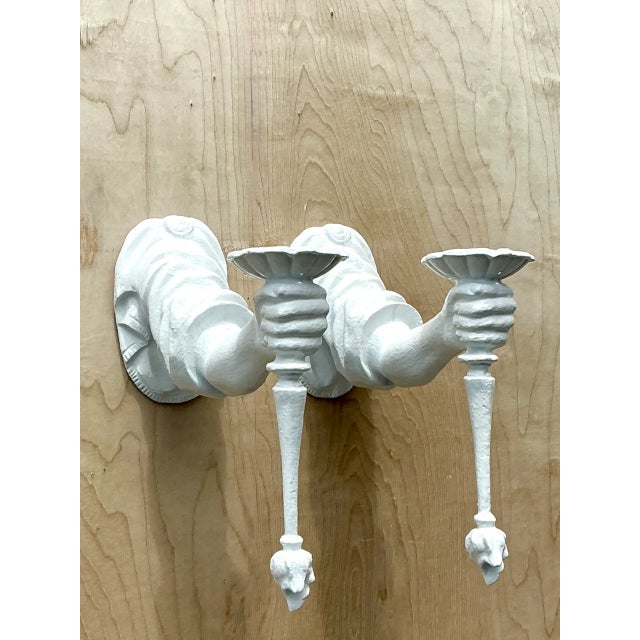 This pair of vintage plaster wall sconces brings sculptural elegance to any interior with a classical arm motif extending...