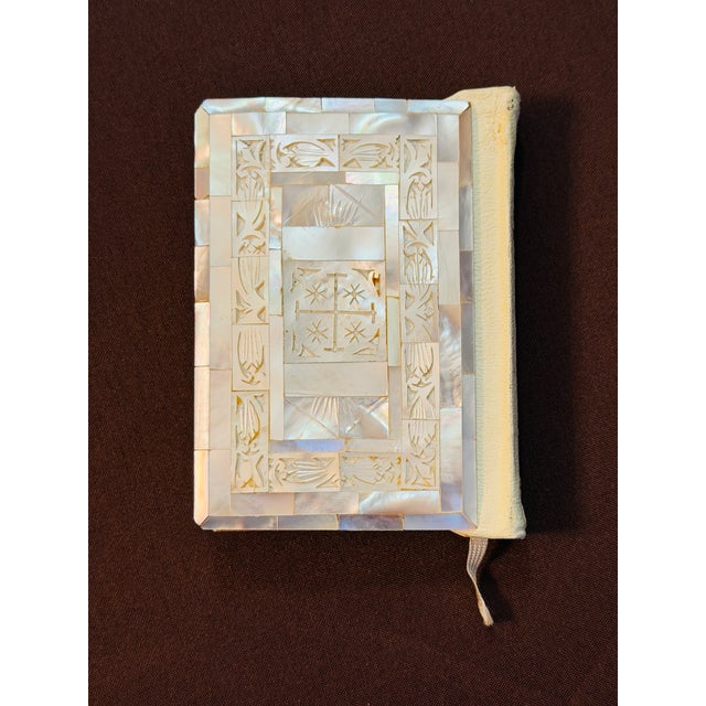 This exquisite King James Version of the New Testament is a rare find. It is bound with a cover of mother-of-pearl...
