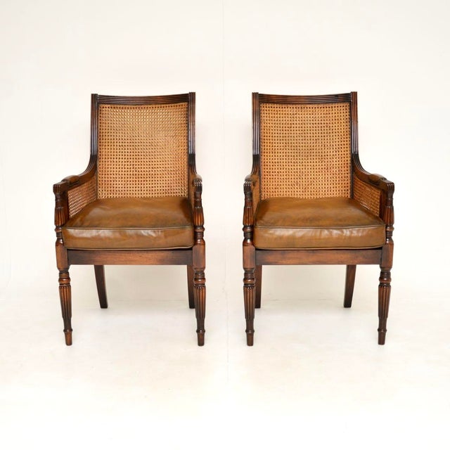 A superb pair of antique Regency style leather cane back armchairs. They were made in England, they date from around the...