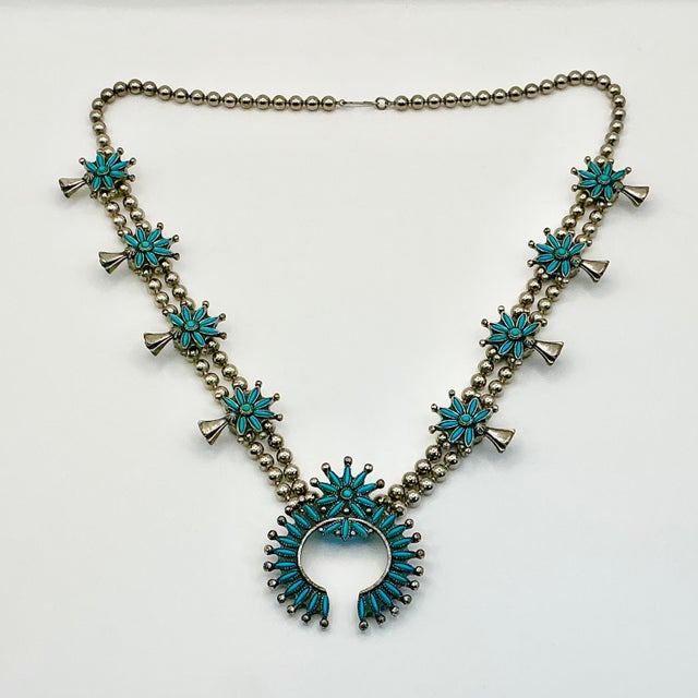 Vintage Home is pleased to present this gorgeous vintage Zuni Native American Squash Blossom Beaded Necklace from the...