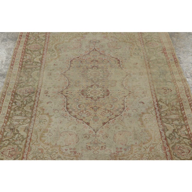 Hand-knotted in natural silk circa 1920-1929, this 4x6 antique Turkish rug is a rare, exquisite gem. It highlights a...