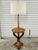 Unique mid-20th Century Neoclassical classical style floor lamp with table tray. The lamp features a tripod base with...