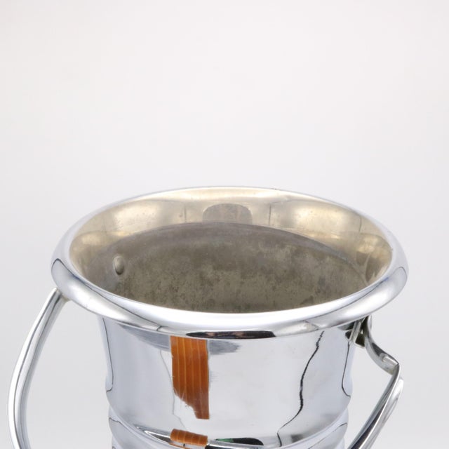 An Art Deco period champagne cooler from France circa 1930. The elegant wine bucket is made of nickel plated brass with...