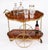 This is a very entertaining vintage two tier Italian Sorrento drop-leaf drinks trolley, mid century in date. The shaped...