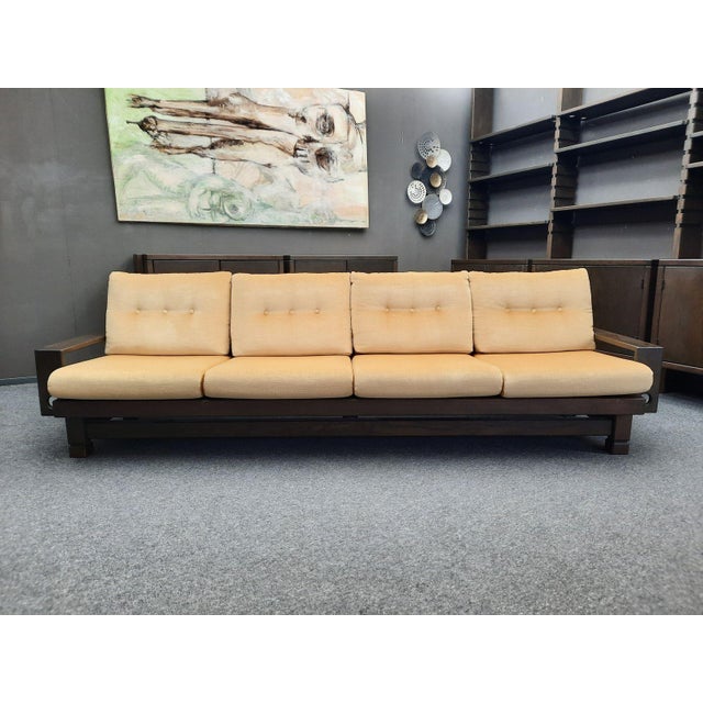 A very rare four-seater sofa, model "St. Moritz" by Klaus Rausch. Brutalism at its finest. Crafted from solid spruce wood....